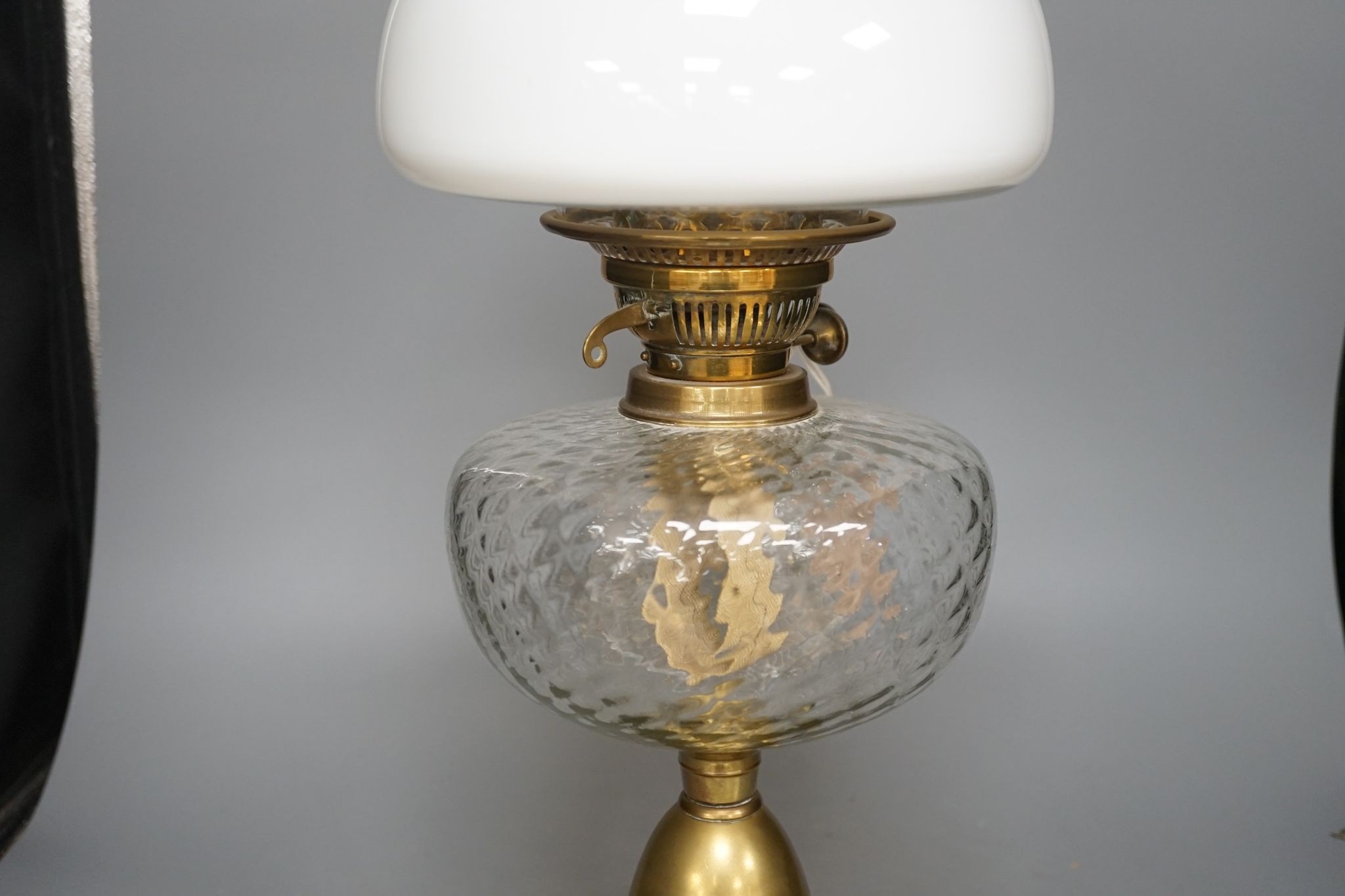 A brass oil lamp with opaque shade 60cm total height